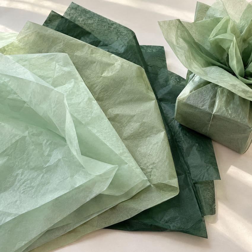 Luxury tissue paper Ireland — mint, sage and bottle green colour tissue sheets with a wrapped gift