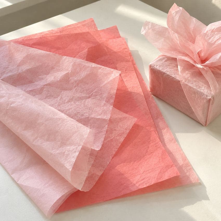 Luxury tissue paper Ireland — blush and coral colour tissue sheets with a pink wrapped gift