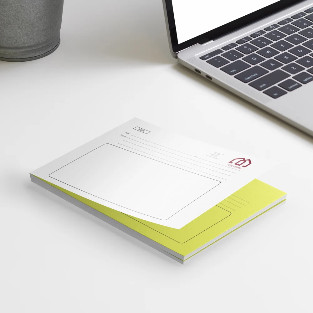 Duplicate NCR pad Ireland — yellow copy sheet on a Cork café desk