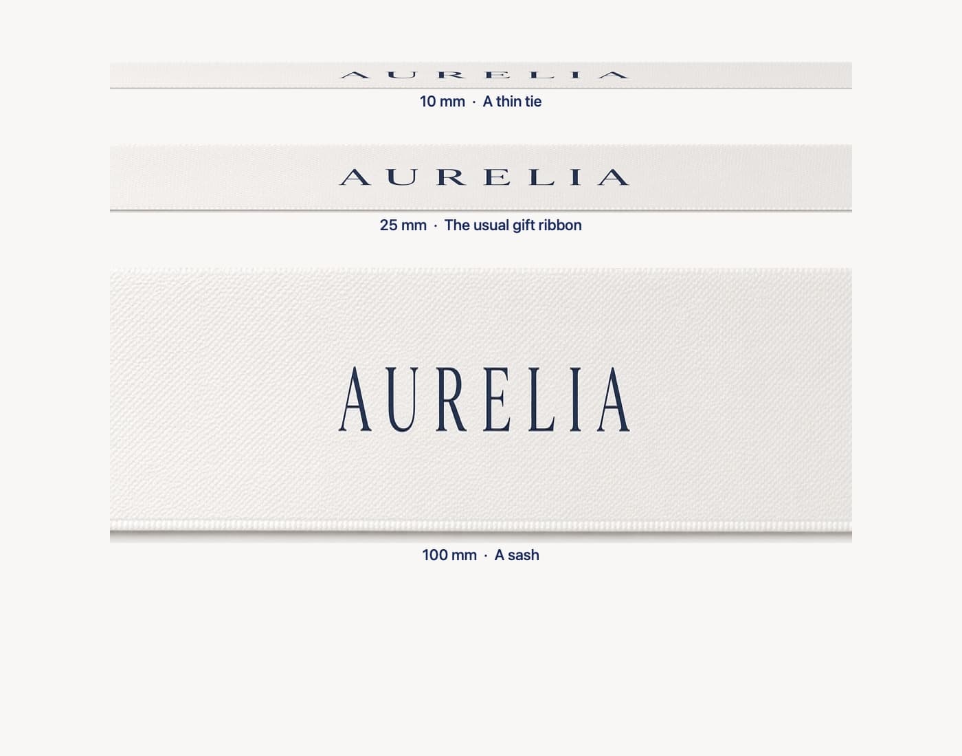 Printed ribbon widths Ireland — 10 mm, 25 mm and 100 mm white satin compared for gift wrap