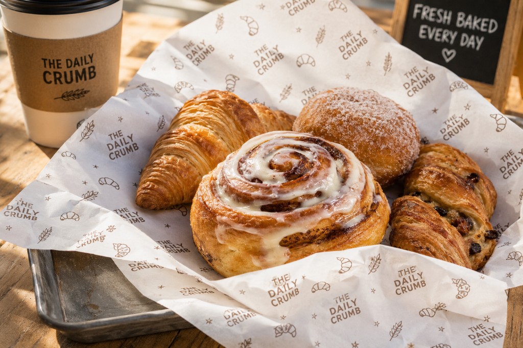 Printed greaseproof paper Ireland — branded bakery tray liner with pastries on custom greaseproof sheets for cafés and patisseries
