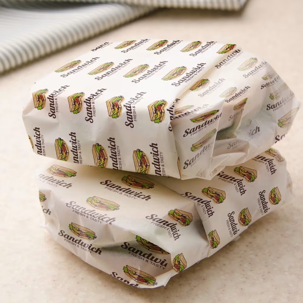 Branded greaseproof paper Ireland — custom printed sandwich wrap sheets for delis and bakeries